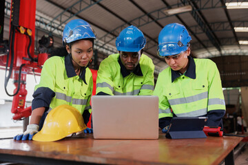 Group of engineer and technician workers video calling, online meeting via laptop computer in the industry factory