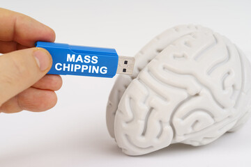 A man inserts a flash drive into his brain with the inscription - mass chipping