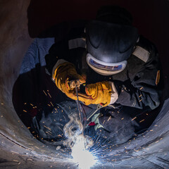 electric welder while working in the pipe