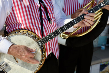 musician playing the banjo at a festival