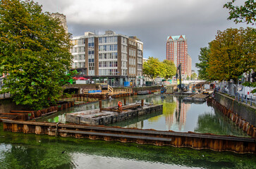 Fototapeta na wymiar Roterdam, The Netherlands, October 15, 2023: downtown Steigergracht canal with work on the future surfing facility