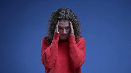 Woman covering face with regret, anxious preoccupied 20s person feeling anguish and annoyance...