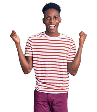 Young african american man wearing casual clothes celebrating surprised and amazed for success with arms raised and open eyes. winner concept.
