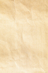 Brown crumpled paper texture with grains macro closeup