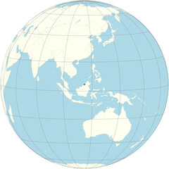 Brunei Darussalam positioned at the center of the world map in an orthographic projection. A tiny country in Southeast Asia, situated on the northern coast of the island of Borneo. 