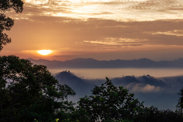 High-angle natural background from a vantage point, overlooking the sun's rays blurred in the morning in the middle of the sea, is a beautiful glowing golden light of nature that can't be seen much.