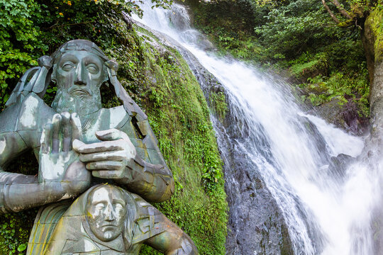 Sarpi, Georgia - September 18, 2023: St. Andrew the First-Called sculpture and Waterfall in Sarpi village, Adjara in autumn. Monument is dedicated to entry of St Andrew the First-Called into Georgia