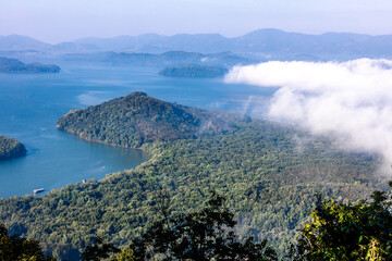 High-angle natural background from a vantage point, overlooking the sun's rays blurred in the morning in the middle of the sea, is a beautiful glowing golden light of nature that can't be seen much.