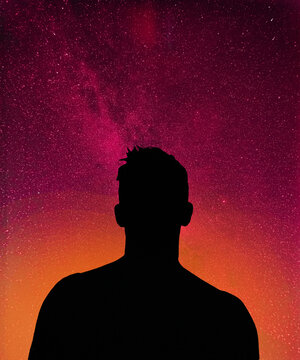 Silhouette of a person looking to the sky