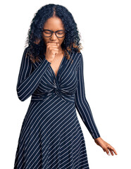 Young african american woman wearing casual clothes and glasses feeling unwell and coughing as...