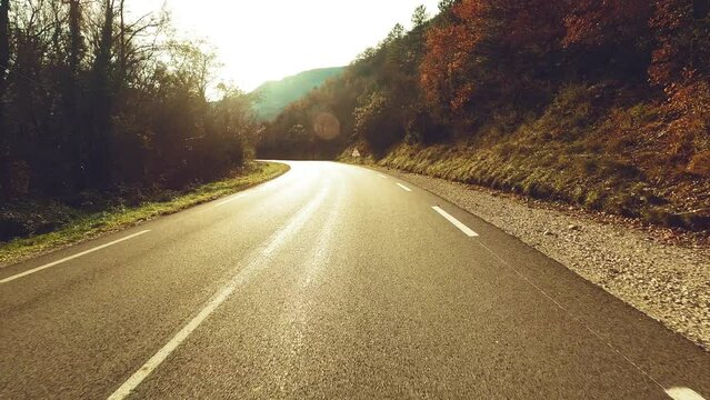 Long asphalt road ground view and travel concept - mountain and sky landscape - outdoor road trip in scenic place background
