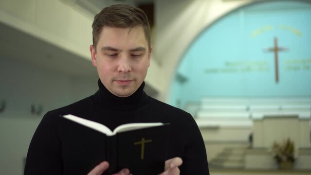 A young man reads the Bible