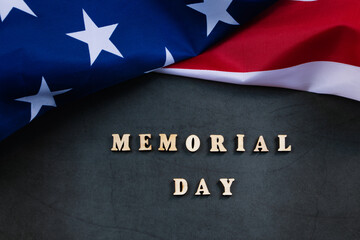 Fototapeta na wymiar American flag on dark background. USA Memorial Day concept. Remember and honor.