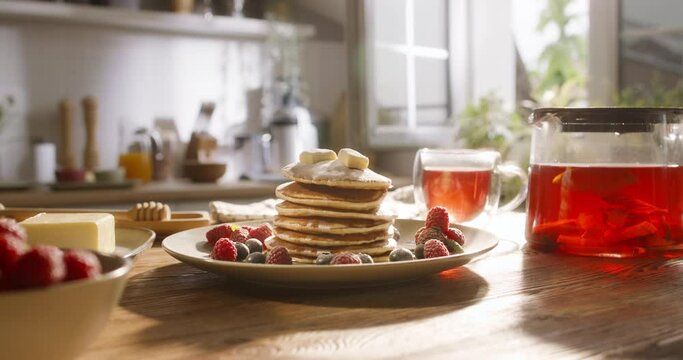Perfectly served American traditional breakfast with pancakes. No people, advertising, cinematic. Weekend with delicious desserts, pleasant family traditions. Art of healthy tasty food, gluten-free
