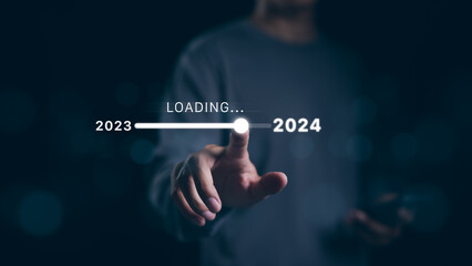 Man hand touching loading bar for countdown to 2024. In progress loading year 2023 to 2024, Planning and challenge business strategy in new year, Countdown merry Christmas and Happy New Year, Startup, - obrazy, fototapety, plakaty