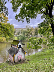 Asian hut landmark in the edge shore in a canal river stream park in Riga, Latvia