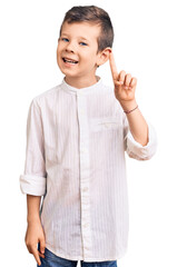 Cute blond kid wearing elegant shirt pointing finger up with successful idea. exited and happy. number one.