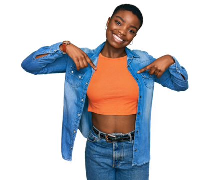 Young african american woman wearing casual clothes looking confident with smile on face, pointing oneself with fingers proud and happy.