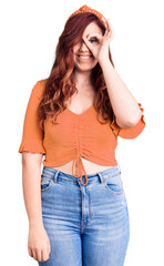 Young beautiful woman wearing casual clothes smiling happy doing ok sign with hand on eye looking through fingers