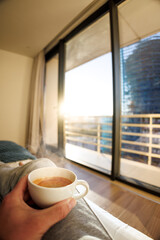A Cup of Morning Coffee in a City Apartment