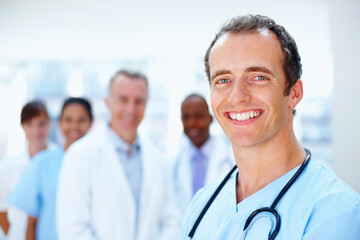 Doctors, man and team portrait in clinic with staff, leadership or together for healthcare...