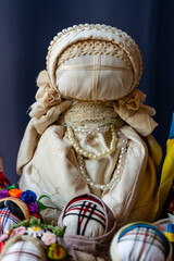 Obraz premium Close-up of a traditional amulet doll for sale to tourists at a street market, Kyiv, Ukraine. Ukrainian motanka dolls