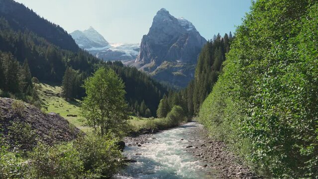 Swiss Alps view of Rosenlaui with Wellhorn and Reichenbach river in summer at Switzerland