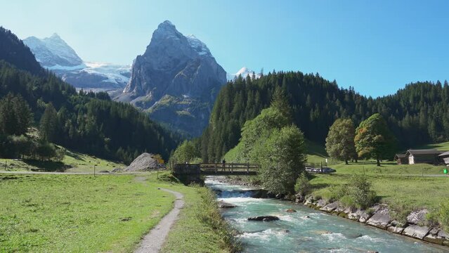 Swiss Alps view of Rosenlaui with Wellhorn and Reichenbach river in summer at Switzerland