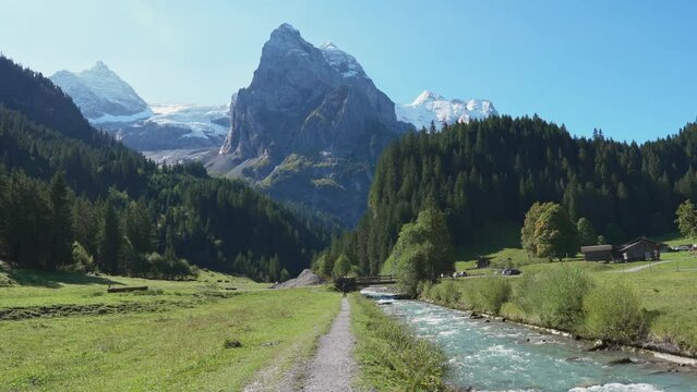 Swiss Alps view of Rosenlaui with Wellhorn and Reichenbach river in summer at Switzerland