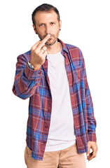 Young handsome man wearing casual clothes showing middle finger, impolite and rude fuck off...