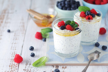 Greek yogurt in glasses with berries and quinoa