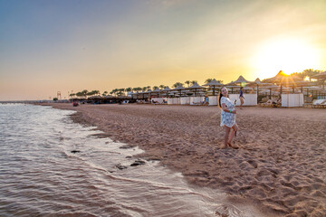 person walking on the beach