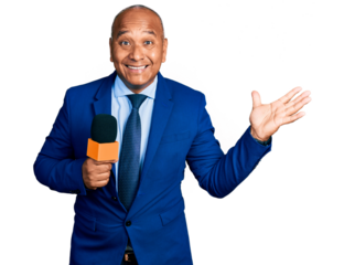 Hispanic middle age man holding reporter microphone celebrating victory with happy smile and winner expression with raised hands