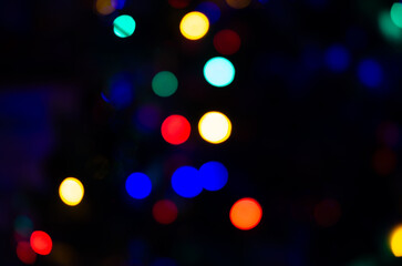 Blurred background lights in the shape of a ball. New Year's background for the designer