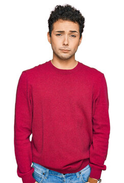 Young handsome man wearing casual clothes depressed and worry for distress, crying angry and afraid. sad expression.