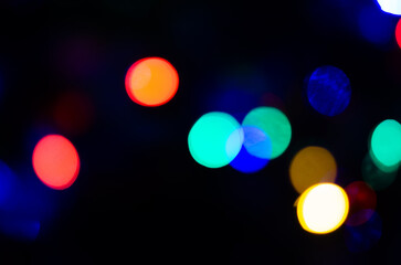 Blurred background lights in the shape of a ball. New Year's background for the designer