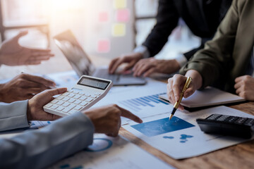 Obraz premium Business people meeting. Close up of hands business people working together in meeting, brainstorming, discussing and analyzing and planning business strategy.