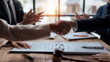 Businessman handshake to seal a deal with his partner lawyers or attorneys discussing a contract agreement. - obrazy, fototapety, plakaty