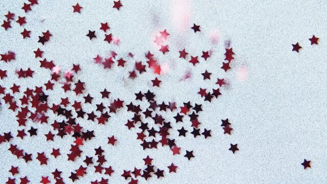 Red stars fall on white background. Happy new year, Traditional lunar year background. Copy space. Confetti. Holiday greeting frame. Glamorous Red Star Falling. Confetti Glitter Rain.