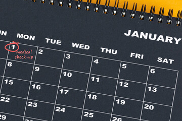 Red circle mark on the calendar at 1 for reminder of medical check up.