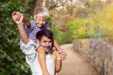 Playful father have fun with son in park