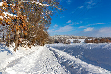 Road in the countryside after heavy snowfall in central Europe