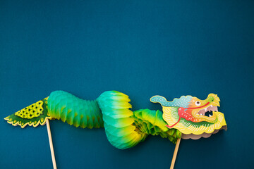 Chinese new year background with green paper dragon.