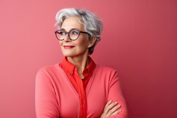Confident and stylish mature woman with gray hair, personifying modern elegance and positive aging.