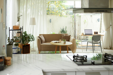 Modern living room area with big windows home design