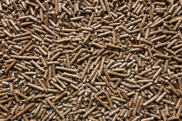 Wooden pellets. Ecologic fuel made from biomass. Renewable energy source. Top view.