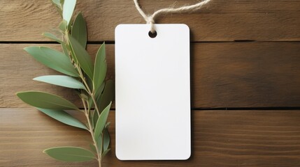 white blank tag with blank front realistic on a mockup template in a wooden table with olive leaf branch