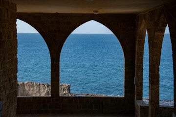 arc of a church with the Phoenician wall and Mediterranean sea at the Lebanese town of Beirut