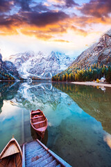 Magical beautiful autumn landscape with boats on the lake on Fanes-Sennes-Braies natural park in...