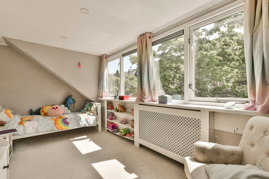 Bedroom with bed and toys with windows